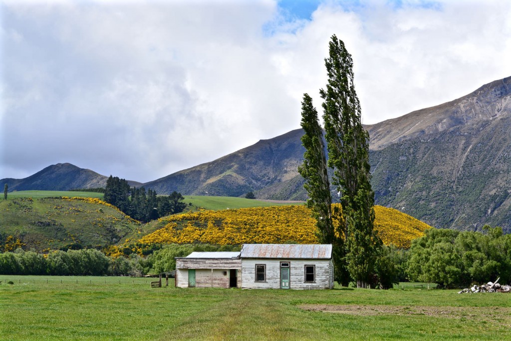 Old house in front of a mountain range